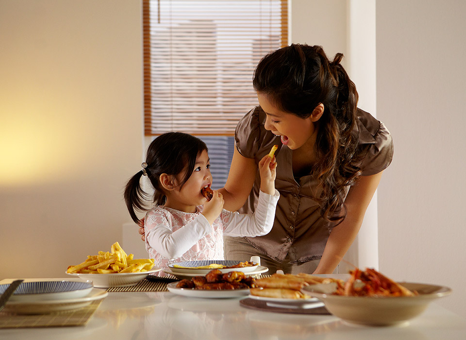 Girl eating chicken